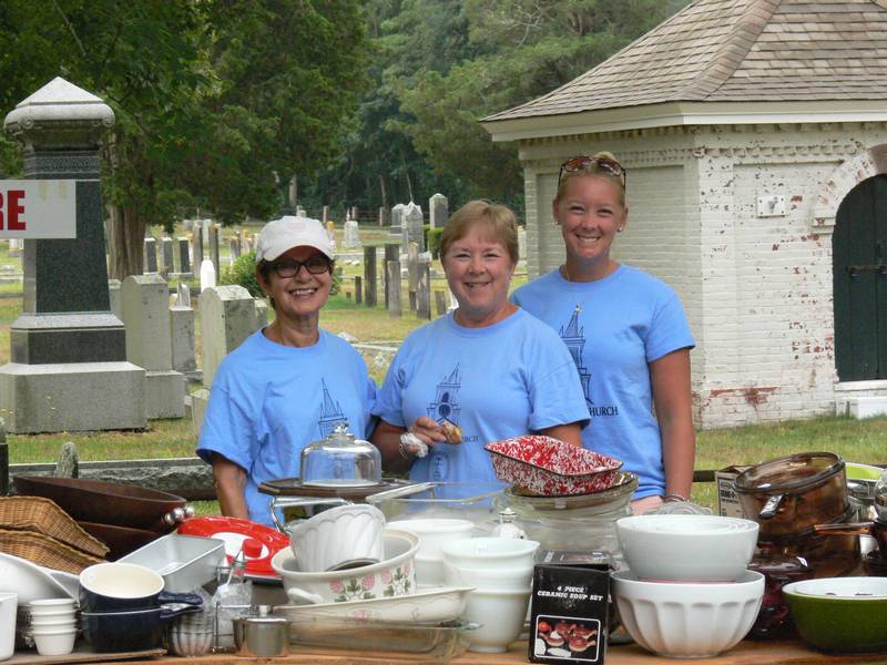 Smiling auction volunteers