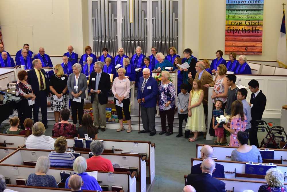 New members stand at the front of the sanctuary to be welcomed